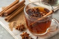 Cinnamon and star anise tea in a glass mug Royalty Free Stock Photo
