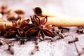 Cinnamon, staranise and cloves. winter spices on wooden background