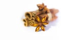 Cinnamon sticks and anise star isolated on white background close up.