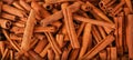 Cinnamon sticks background. Wide Angle Wallpaper or Web banner. Aphrodisiac food for desire Royalty Free Stock Photo