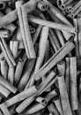 Cinnamon sticks in a bazaar, black and white, vertical Royalty Free Stock Photo