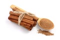 Cinnamon sticks bunch with powder isolated on white background. Top view Royalty Free Stock Photo