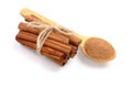 Cinnamon sticks bunch with powder on white background. Top view Royalty Free Stock Photo