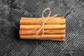 Cinnamon sticks bundle with rope. Aromatic seasoning Royalty Free Stock Photo