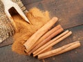 Cinnamon sticks and cinnamon powder in scoop Royalty Free Stock Photo