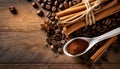 cinnamon sticks coffee beans and spoon on wooden table closeup macro shot , copy space for text Royalty Free Stock Photo