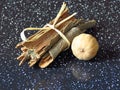 Cinnamon sticks and a dried lime lemon on dark background. Spice. Royalty Free Stock Photo