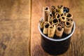 Cinnamon sticks isolated on background rustic wood inside black mug
