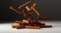 Cinnamon sticks levitating above a pile, against a dark background with spice dust Royalty Free Stock Photo