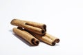 Cinnamon sticks lying on white background