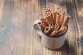 Cinnamon sticks. Mug full of cinnamon sticks on a wooden table. Copyspace Royalty Free Stock Photo