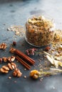 Cinnamon sticks, nuts and a herb collection scattered on a blue Royalty Free Stock Photo