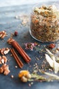 Cinnamon sticks, nuts and a herb collection scattered on a blue Royalty Free Stock Photo