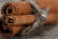 Cinnamon sticks on old wooden background. Royalty Free Stock Photo