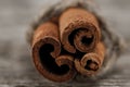Cinnamon sticks on old wooden background. Royalty Free Stock Photo
