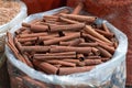 Cinnamon sticks in a plastic bags at bazaar Royalty Free Stock Photo