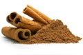 Cinnamon sticks and powder close-up view, macro photography, isolated on white background high quality details Royalty Free Stock Photo