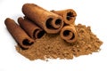 Cinnamon sticks and powder close-up view, macro photography, isolated on white background high quality details Royalty Free Stock Photo