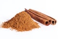 Cinnamon sticks and powder isolated on white background, close up Royalty Free Stock Photo