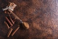 Cinnamon sticks and powder in spoon on a old copper table . Royalty Free Stock Photo