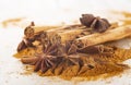 Cinnamon sticks and powder with star anise on copy space Royalty Free Stock Photo