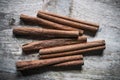 Cinnamon sticks with cinnamon powder on stone plate background Royalty Free Stock Photo