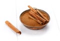Cinnamon sticks and powder on white Royalty Free Stock Photo