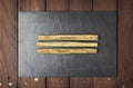 Cinnamon sticks on slate plate