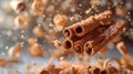 Cinnamon Sticks with small Crumbs fall on light yellow blurred background. Creative concept of floating and falling spyce Royalty Free Stock Photo