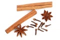 Cinnamon sticks with star anise and clove isolated on white background. Top view Royalty Free Stock Photo