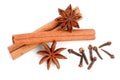 Cinnamon sticks with star anise and clove isolated on white background. Top view Royalty Free Stock Photo