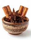 Cinnamon Sticks and Star Anise in Glazed Ceramic Bowl on White Background Royalty Free Stock Photo