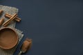 Cinnamon sticks, tied with jute rope in rustic style. Ground cinnamon in a wooden bowl and vintage scoop. Close up on a Royalty Free Stock Photo