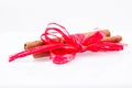 Cinnamon sticks tied with a red ribbon Royalty Free Stock Photo