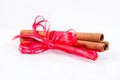 Cinnamon sticks tied with a red ribbon Royalty Free Stock Photo