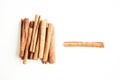 Cinnamon sticks on the white background, flat lay
