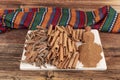 Cinnamon sticks on a wooden background. Cinnamon spice in a spoon and bowl. Ceylon cinnamon. Cinnamon dried bark strips and Royalty Free Stock Photo