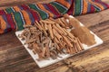 Cinnamon sticks on a wooden background. Cinnamon spice in a spoon and bowl. Ceylon cinnamon. Cinnamon dried bark strips and Royalty Free Stock Photo