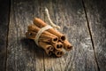 Cinnamon sticks on wooden background Royalty Free Stock Photo