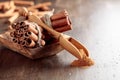 Cinnamon sticks and a wooden spoon with powder Royalty Free Stock Photo