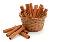 Cinnamon Sticks in Woven Basket Displayed on Clean Surface Royalty Free Stock Photo