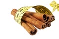 Cinnamon sticks wrapped roulette on a white background