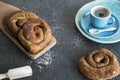 Tea time with Dutch cinnamon, sugar bread roll, called Bolus. Royalty Free Stock Photo