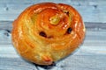 Cinnamon swirl puff roll sweetened with honey and raisins and filled with custard cream baked, selective focus of pastries Royalty Free Stock Photo