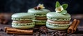 Cinnamon and vanilla bean green macarons on a dark slate background, with blank space available for text and copy Royalty Free Stock Photo