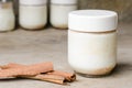 Cinnamon yogurt, rustic background. Royalty Free Stock Photo