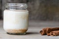 Cinnamon yogurt, rustic background. Royalty Free Stock Photo