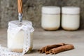 Cinnamon yogurt, rustic background. Royalty Free Stock Photo