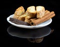 Cinnanon sticks, chocolate and bisquits Royalty Free Stock Photo