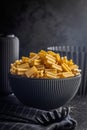 Cinque buchi. Uncooked italian pasta in bowl on black table Royalty Free Stock Photo
